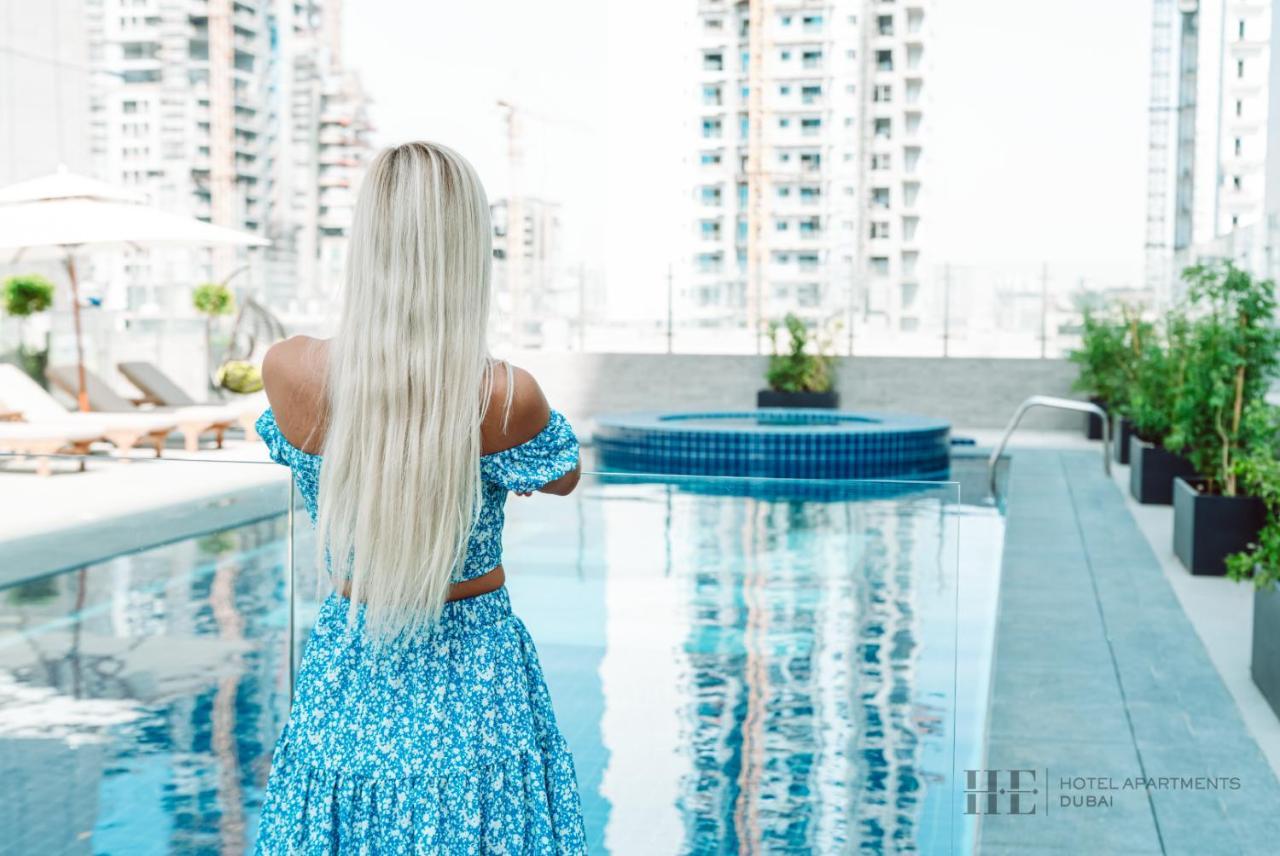 He Hotel Apartments Dubai Exterior photo A woman with long hair